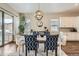 Elegant dining area with contemporary furnishings, a stylish chandelier, and access to outdoor living at 2134 S Poppy St, Lakewood, CO 80228