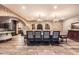 Elegant dining room with stone accents, a long table with chairs, and decorative lighting at 2134 S Poppy St, Lakewood, CO 80228
