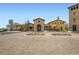 Elegant Tuscan-style home with a grand entrance, beautiful stonework, and meticulous landscaping at 2134 S Poppy St, Lakewood, CO 80228