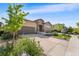Beautifully landscaped home exterior with a spacious driveway and modern architectural design at 2134 S Poppy St, Lakewood, CO 80228