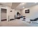 Finished home gym featuring carpeted floors and workout equipment at 2134 S Poppy St, Lakewood, CO 80228