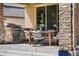 Covered patio featuring an outdoor kitchen and dining area for entertaining at 2134 S Poppy St, Lakewood, CO 80228