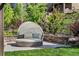 Relaxing outdoor cabana seating area surrounded by lush landscaping at 2134 S Poppy St, Lakewood, CO 80228