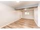 Bedroom featuring vinyl wood floors at 5898 Parfet Ct, Arvada, CO 80004