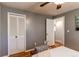 Neutral bedroom with wood floors, closet and doorway at 5898 Parfet Ct, Arvada, CO 80004