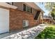 Exterior elevation featuring red brick and gray siding at 5898 Parfet Ct, Arvada, CO 80004