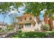 Charming brick home with a covered front porch and well-maintained front yard landscaping at 1176 Gaylord St # 101, Denver, CO 80206
