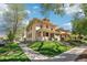 Two-story home with sidewalk and grassy area; home has a covered porch and classic architectural details at 1176 Gaylord St # 101, Denver, CO 80206