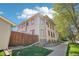 View of the property with fenced backyard, showcasing the side yard and street view at 1176 Gaylord St # 101, Denver, CO 80206