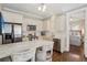 Well-appointed kitchen with white cabinets, granite countertops, and stainless steel appliances at 1176 Gaylord St # 101, Denver, CO 80206