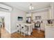 Bright kitchen features white cabinets, marble counters, stainless steel appliances and island with seating at 1176 Gaylord St # 101, Denver, CO 80206