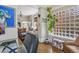 Cozy view from the office space into the sun-lit living room and additional living spaces at 1176 Gaylord St # 101, Denver, CO 80206