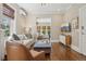 Open-concept living area with hardwood floors and comfortable furniture, bathed in natural light at 1176 Gaylord St # 101, Denver, CO 80206
