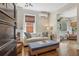 Bright living room with hardwood floors, comfortable seating, and charming architectural details at 1176 Gaylord St # 101, Denver, CO 80206