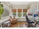 Bright home office featuring a wall of glass block windows and a comfortable workspace at 1176 Gaylord St # 101, Denver, CO 80206