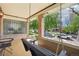Inviting covered porch featuring a porch swing, decorative glass block, and seating area at 1176 Gaylord St # 101, Denver, CO 80206