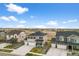 Aerial view of homes with green lawns and long driveways at 17311 Rose Mallow St, Parker, CO 80134