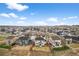 A neighborhood with many new houses is displayed in an aerial view, with some backyards still under construction at 17311 Rose Mallow St, Parker, CO 80134