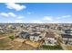 Aerial view of a suburban neighborhood showcasing the layout, landscaping, and proximity to open spaces at 17311 Rose Mallow St, Parker, CO 80134