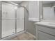 Modern bathroom with a glass-enclosed shower and a quartz countertop at 17311 Rose Mallow St, Parker, CO 80134