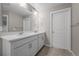 Bright bathroom featuring a double vanity with white countertops and cabinets at 17311 Rose Mallow St, Parker, CO 80134