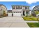 Charming two-story home with a three car garage, landscaped yard and a welcoming front porch at 17311 Rose Mallow St, Parker, CO 80134