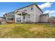 Two-story home with a covered patio and landscaped yard at 17311 Rose Mallow St, Parker, CO 80134