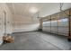 Spacious garage with concrete flooring and overhead door at 17311 Rose Mallow St, Parker, CO 80134