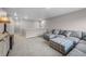 Cozy upstairs living room with comfortable sectional sofa, ottoman, and neutral carpeting at 17311 Rose Mallow St, Parker, CO 80134