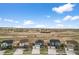 New two-story homes line the street, with open space in the distance under a bright blue sky at 17311 Rose Mallow St, Parker, CO 80134