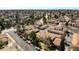 Elevated perspective of a residential area featuring tree-lined streets, well-maintained homes, and ample parking at 3657 S Laredo St # E, Aurora, CO 80013