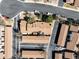 Bird's-eye view of the neighborhood highlighting the layout of homes, parking areas, and surrounding trees at 3657 S Laredo St # E, Aurora, CO 80013