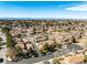 Wide aerial shot of the neighborhood with distant mountain views, showcasing the well-spaced homes and mature trees at 3657 S Laredo St # E, Aurora, CO 80013