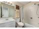 Bathroom boasts a vanity, toilet, and a shower-tub combination with a curtain at 3657 S Laredo St # E, Aurora, CO 80013