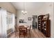 Charming dining area with hardwood floors, natural light, and open access to the adjacent kitchen at 3657 S Laredo St # E, Aurora, CO 80013