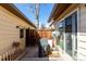 Enclosed patio featuring a small garden and a table with covered grill, providing a cozy outdoor space at 3657 S Laredo St # E, Aurora, CO 80013
