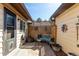 Private patio area with a small table, bench, and bamboo style screen in a cozy outdoor space at 3657 S Laredo St # E, Aurora, CO 80013