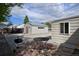Backyard featuring a small metal table and barbecue grill, and a garage at 5525 Pierce Ct, Arvada, CO 80002