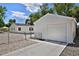 Exterior of a well-maintained detached garage with a new concrete driveway at 5525 Pierce Ct, Arvada, CO 80002