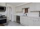 Modern kitchen with white countertops, cabinetry, and stainless steel appliances at 5525 Pierce Ct, Arvada, CO 80002