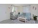 Cozy living room featuring a comfortable recliner and stylish blue sofa at 5525 Pierce Ct, Arvada, CO 80002