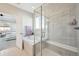 A luxurious bathroom with a separate shower, soaking tub, and a convenient window for natural light at 15993 E 112 Pl, Commerce City, CO 80022