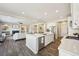 Open concept kitchen and living room with large island and modern finishes at 15993 E 112 Pl, Commerce City, CO 80022