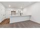Basement bar area with quartz countertops, white cabinets, a sink, and space for stools at 24778 E 40Th Ave, Aurora, CO 80019