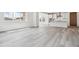 Open concept kitchen with stainless steel appliances, and light gray wood-look flooring at 24778 E 40Th Ave, Aurora, CO 80019
