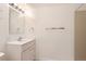 Bathroom features include bright lighting, a modern sink, and a neutral color scheme at 11437 W 103Rd Ave, Broomfield, CO 80021