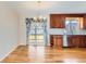 Dining area featuring hardwood floors, chandelier, and slider doors providing backyard views at 11437 W 103Rd Ave, Broomfield, CO 80021