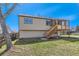 Home exterior showing a large screened-in deck and a well-maintained yard at 11437 W 103Rd Ave, Broomfield, CO 80021