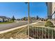 Neighborhood view from the porch showing a quiet street with well-maintained homes and lawns at 11437 W 103Rd Ave, Broomfield, CO 80021