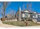 Suburban two story home featuring neutral siding, landscaped yard, brick accents, and a side access garage at 11437 W 103Rd Ave, Broomfield, CO 80021